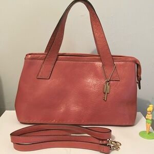 Fossil Vintage Pink Leather Elegant Handbag and Crossbody.has chrome feet.